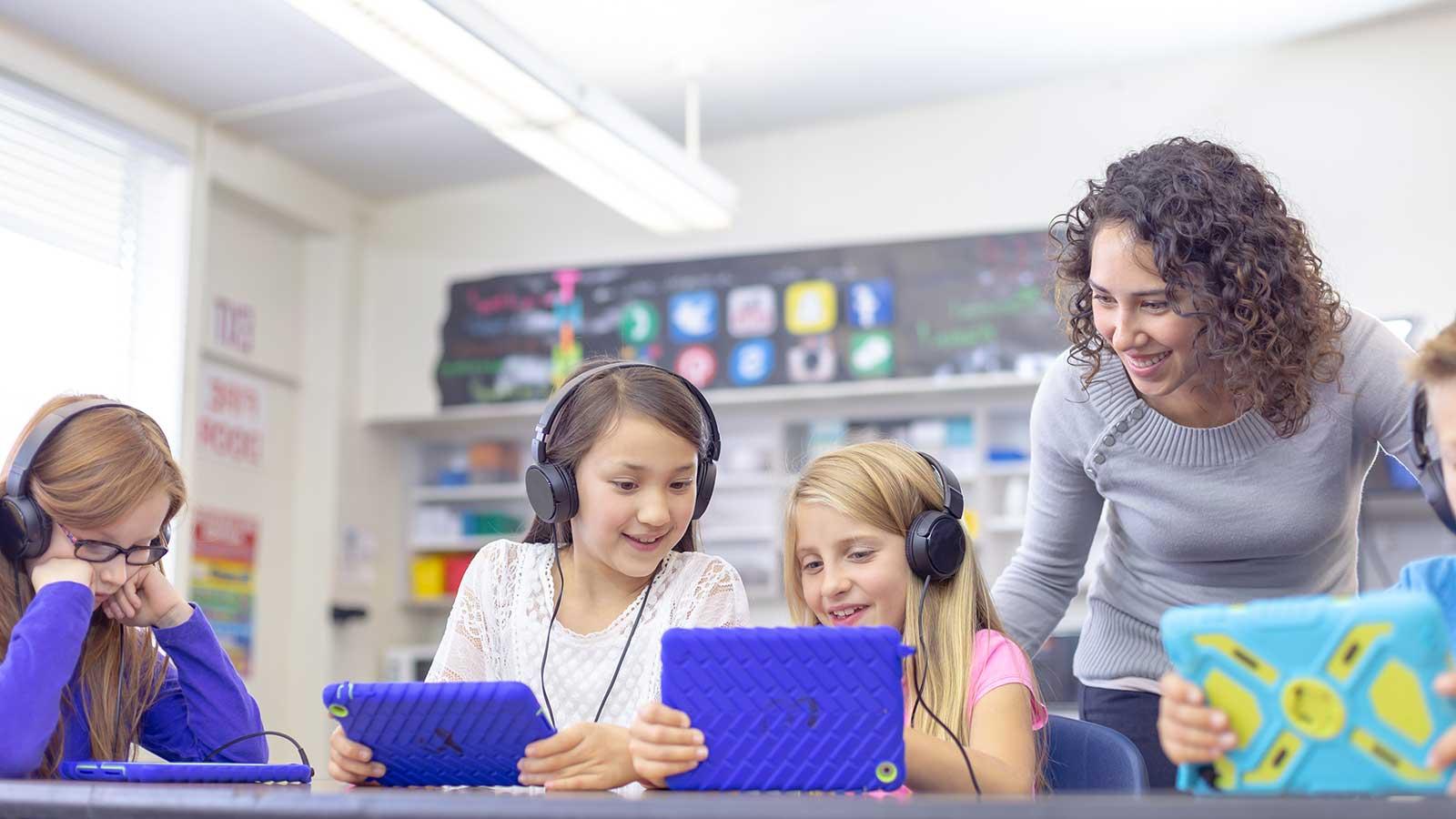 Students working with a teacher